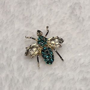 Vintage Gold tone bee or hornet with green crystal stones